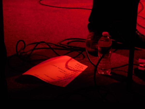 Red-lit photo of setlist for Just Mustard at Polaris Hall, May 10th